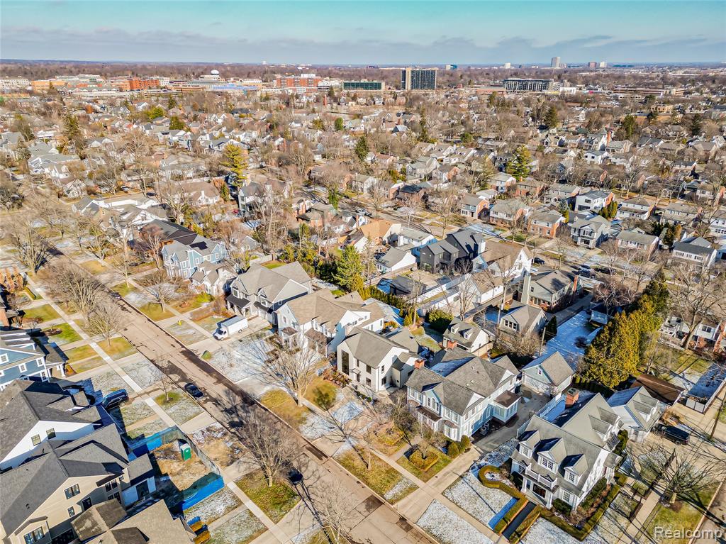 Aerial overview of property's location featuring nearby suburban area