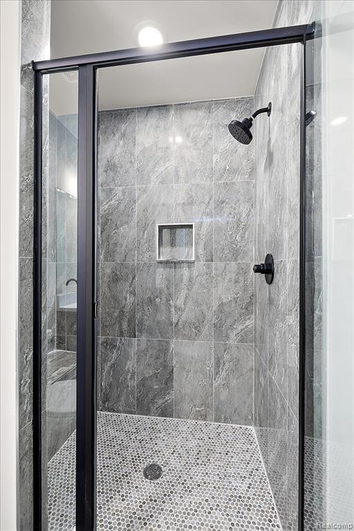 Full bath with a shower stall