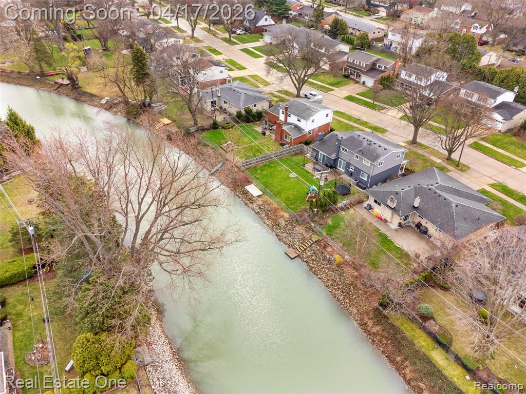 Aerial view of residential area with a nearby body of water