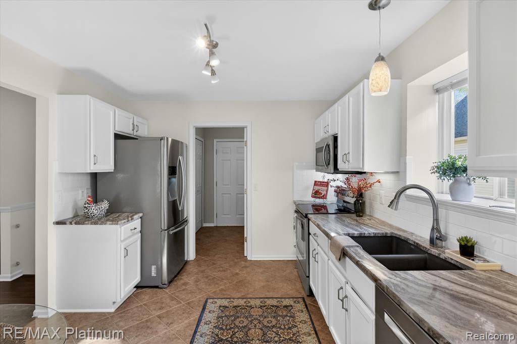 540 Snowfall Court, Howell, MI 48843 — Photo 13