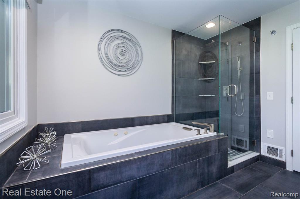 Whirlpool tub and separate Euro glass porcelain tiled shower