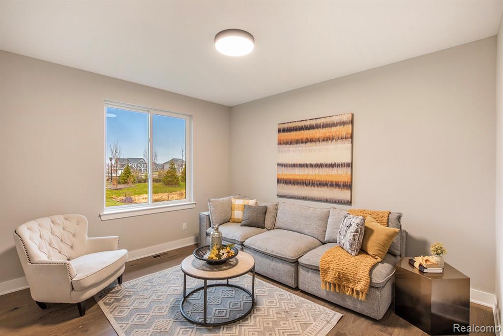 Living area featuring wood finished floors and baseboards