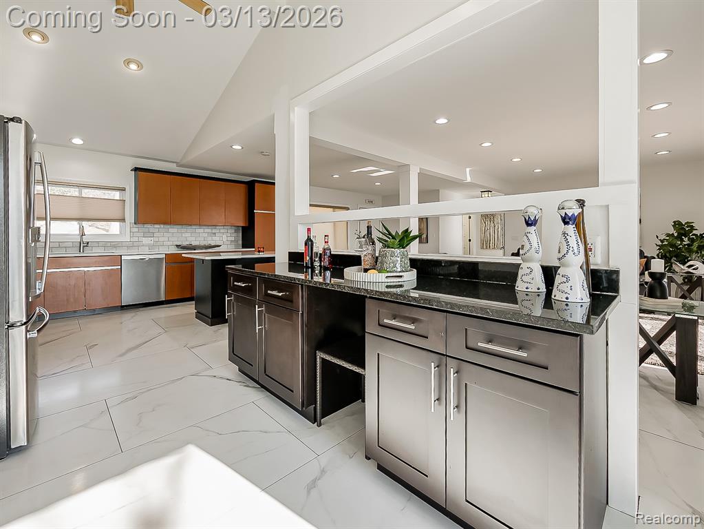 Dining room featuring recessed lighting and light marble finish floors