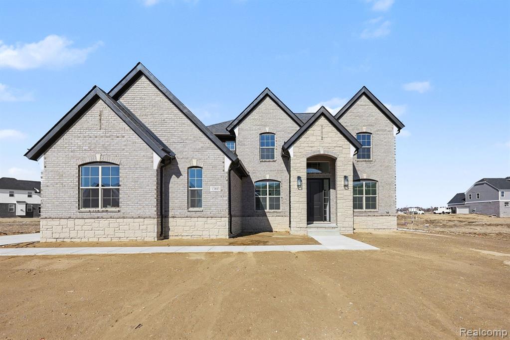 56270 Stone Falcon E, Shelby Twp, MI 48316 — front exterior