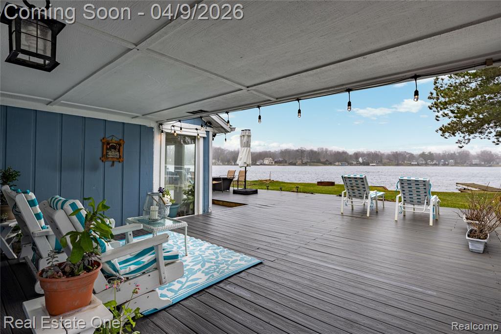 Wooden terrace featuring a water view