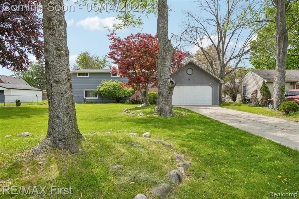 23041 Springbrook Drive, Farmington, MI 48336 — front exterior