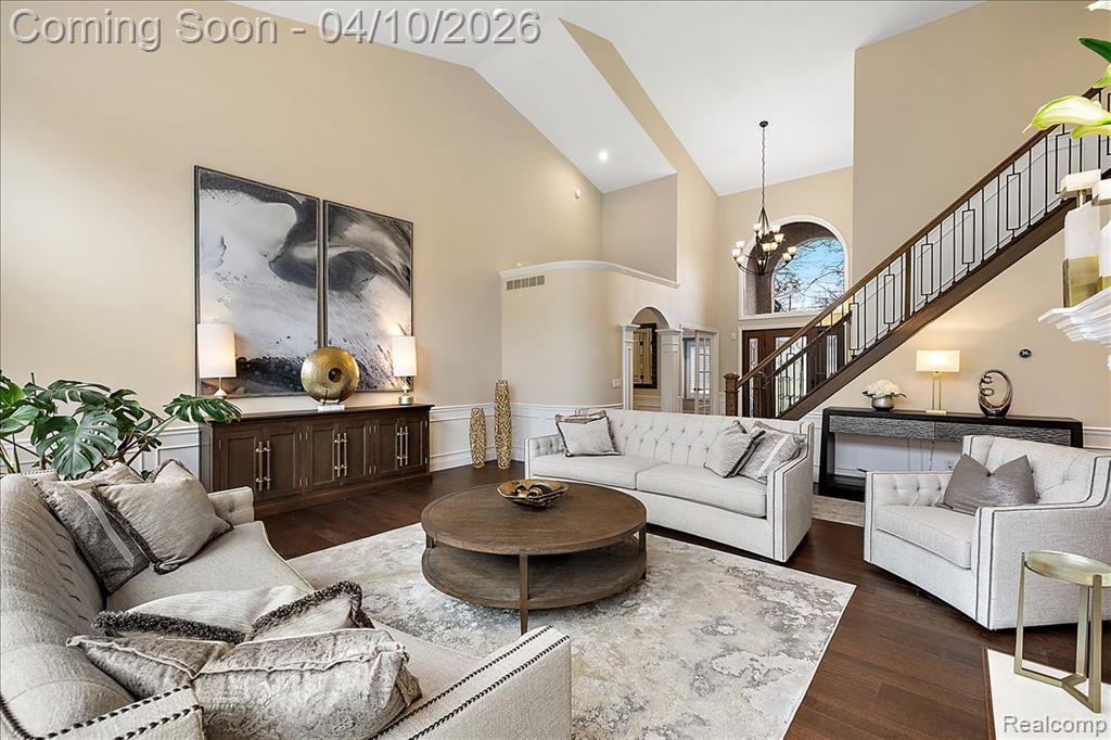 2 Story Living Room w/Double Sided Fireplace & Custom Millwork
