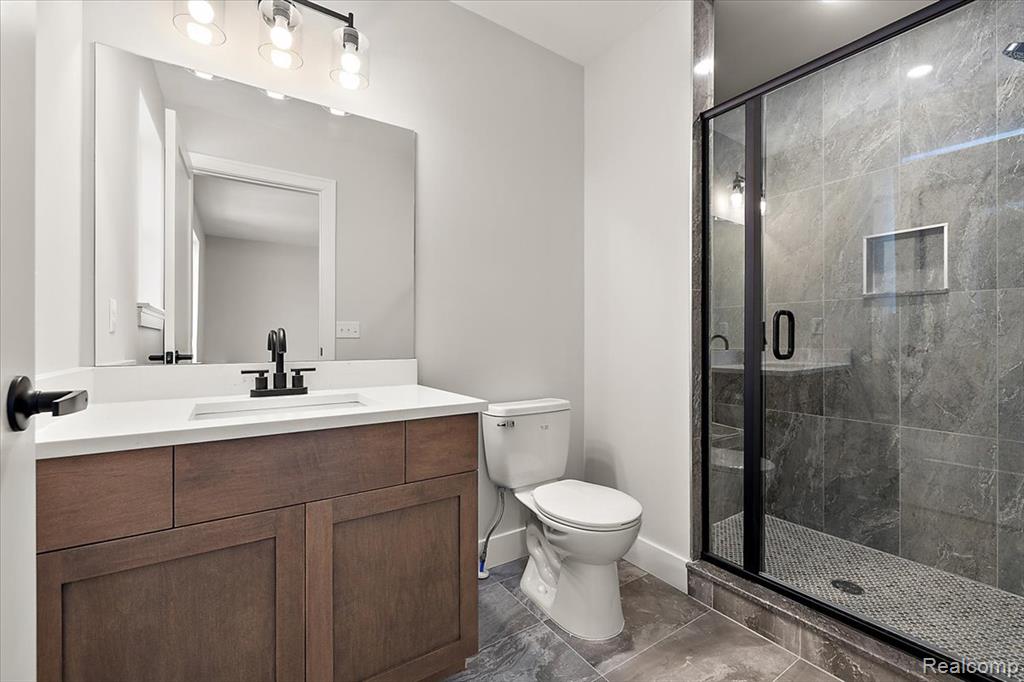 Bathroom with vanity and walk in shower
