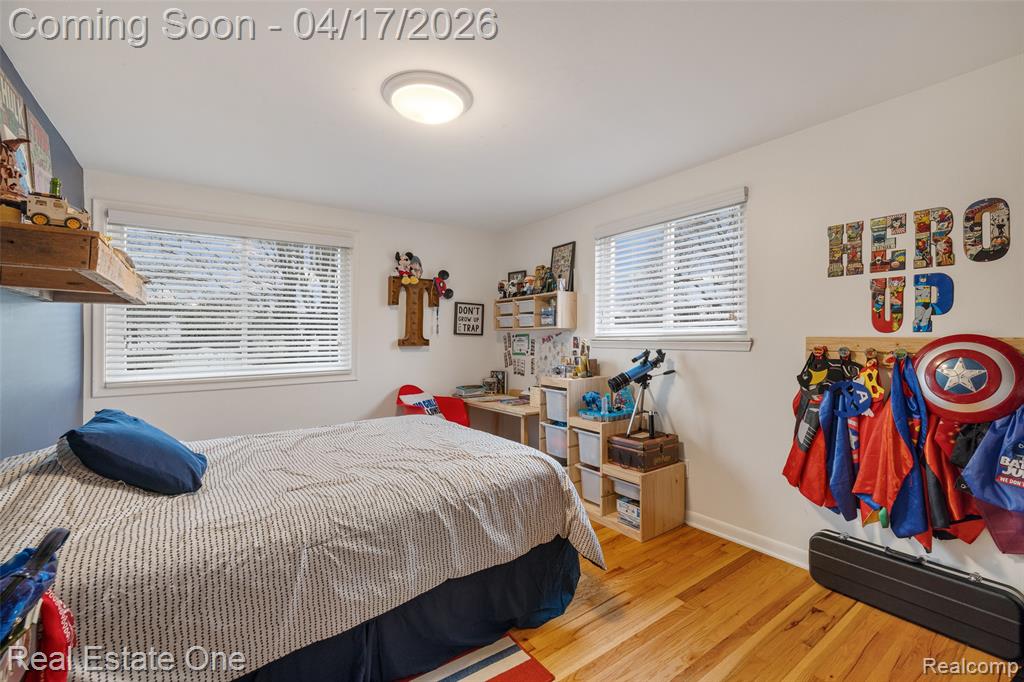 Bedroom featuring light wood-style floors and baseboards