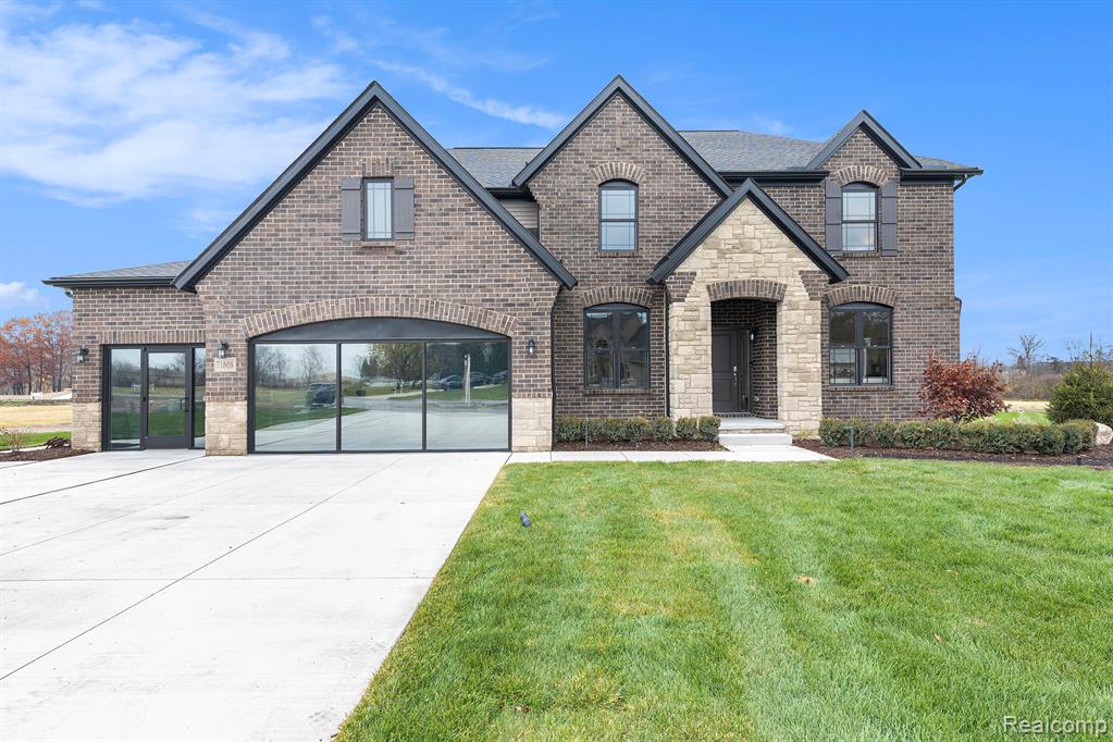 7699 Orchard Lane, Washington, MI 48095 — front exterior