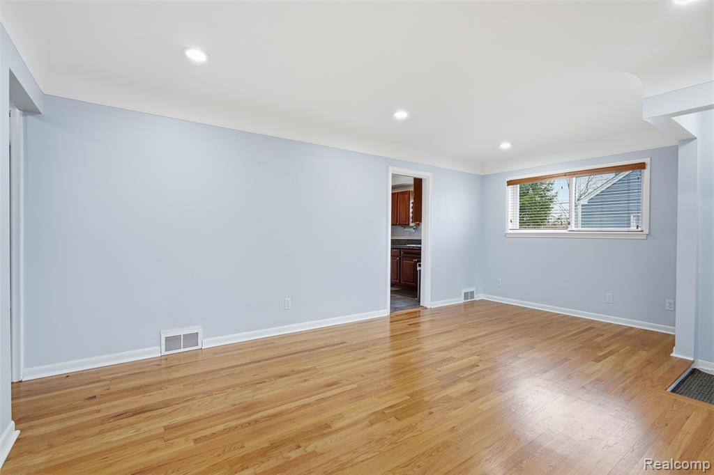 Spare room with recessed lighting and light wood-style flooring