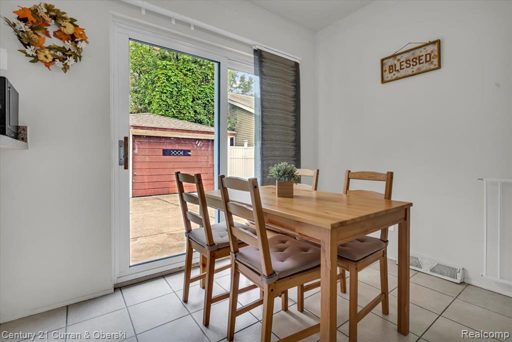 Dining space with door wall to the backyard