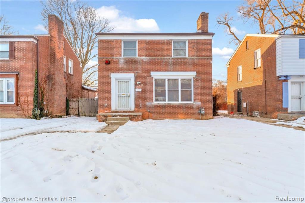 Photo for 15751 Vaughan Street, Detroit, MI 48223 - listing #20251061799 View of front of house with brick siding and a chimney