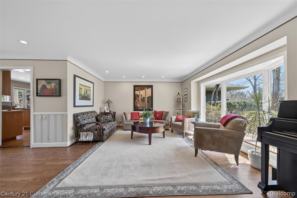 Living room featuring wood finished floors and recessed lighting