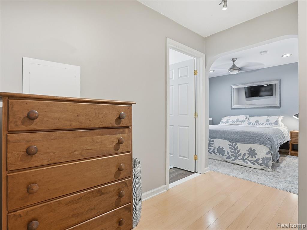 Bedroom featuring light wood finished floors and baseboards