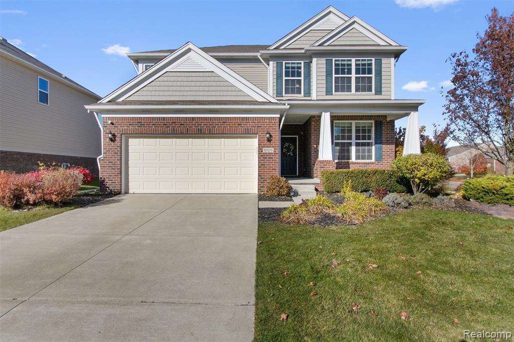 57570 Village Drive, New Hudson, MI 48165 — front exterior
