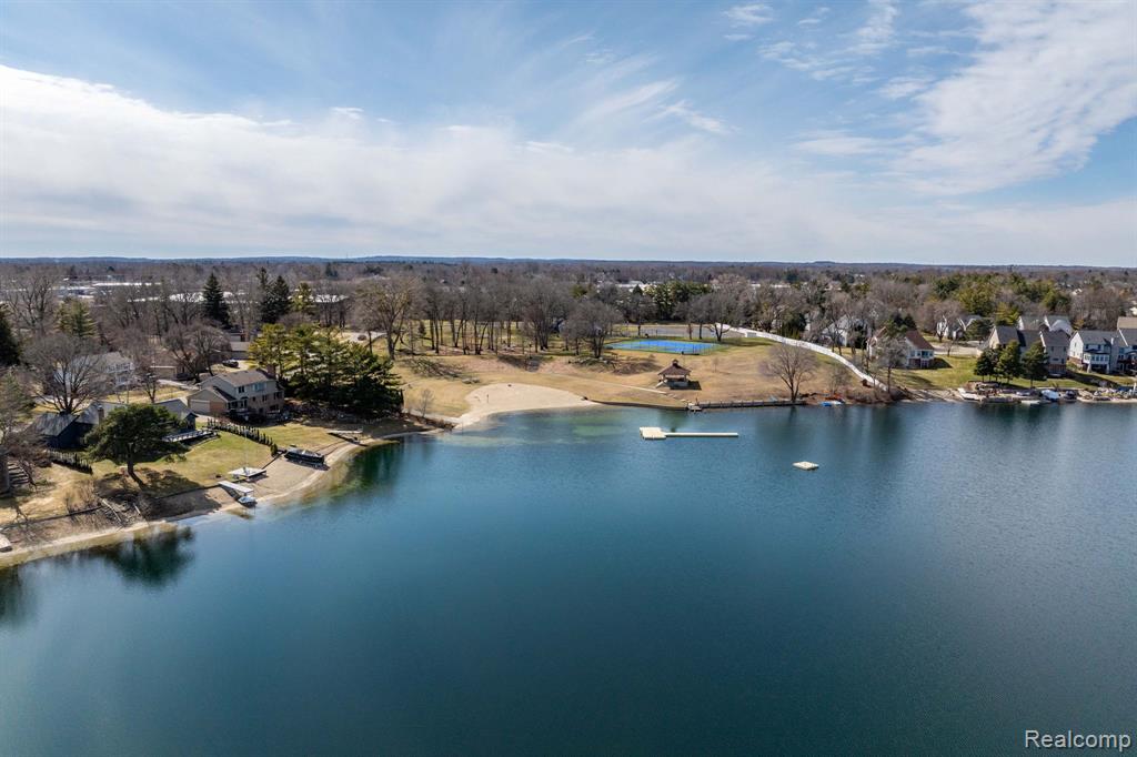Aerial view of a large body of water and a tree filled landscape