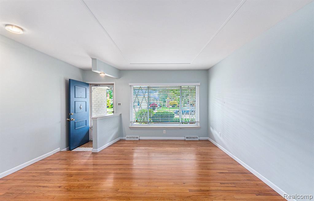 Unfurnished room with light wood finished floors