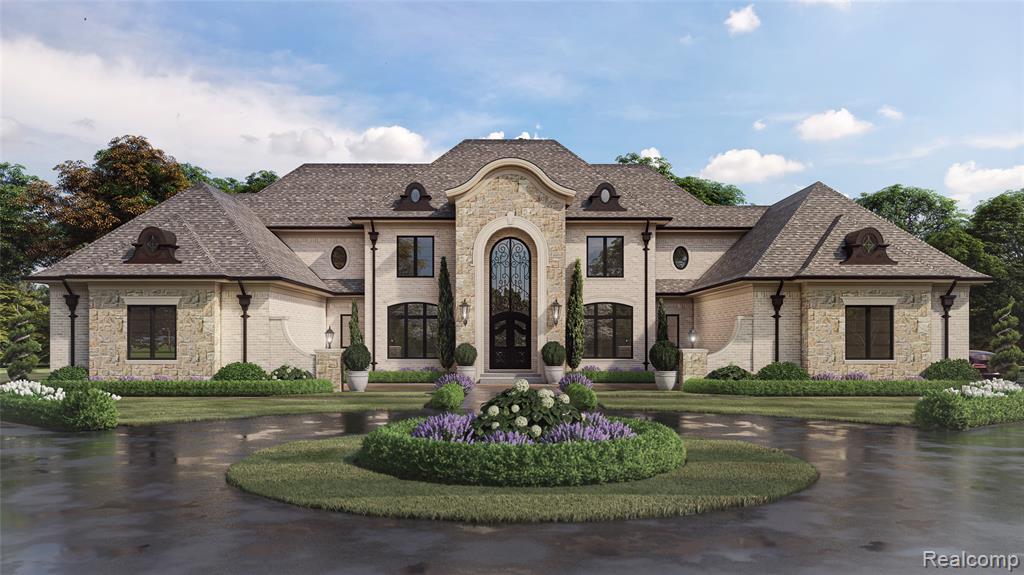 French country home featuring stone siding and curved driveway