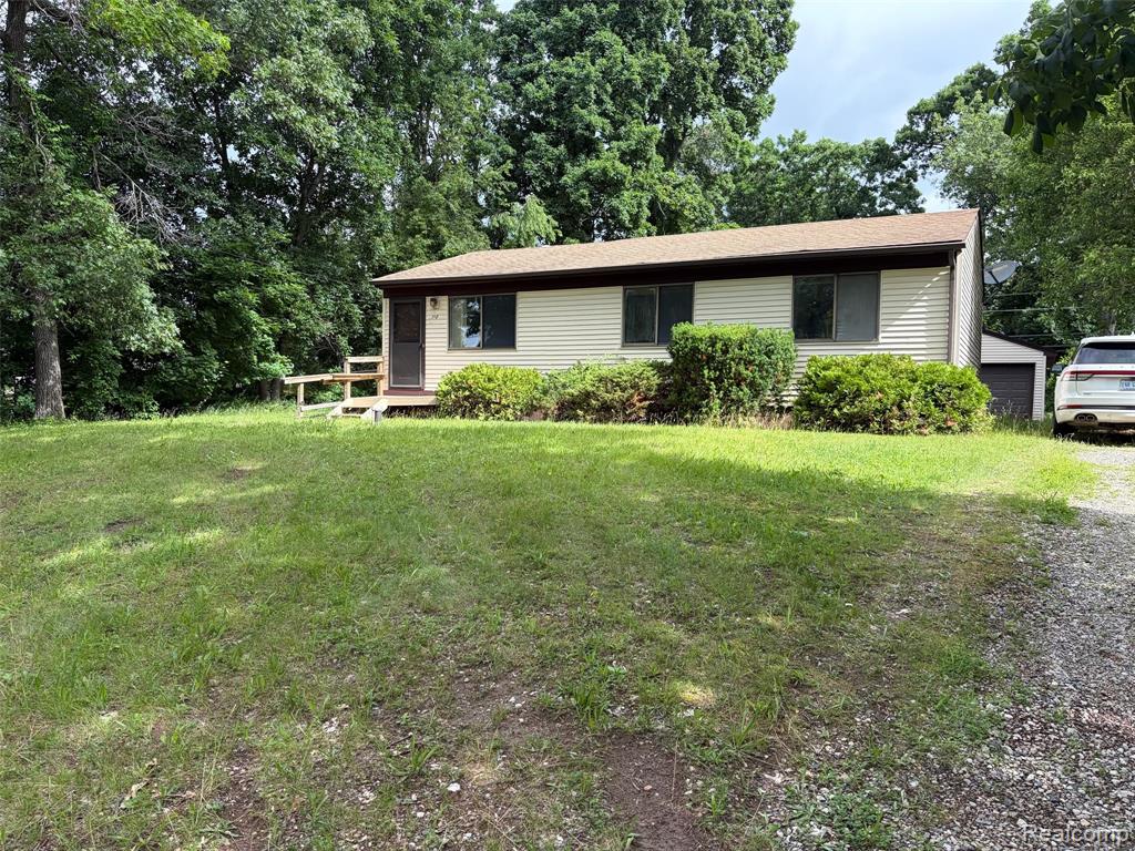 718 W Baker Road, Highland, MI — front exterior