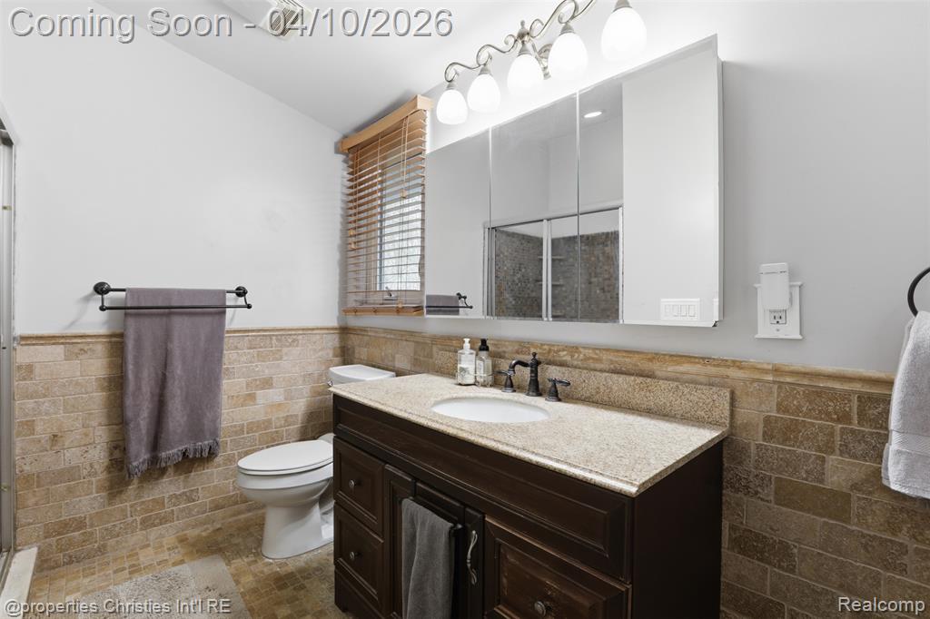 Large primary bathroom features spacious vanity and two showers.
