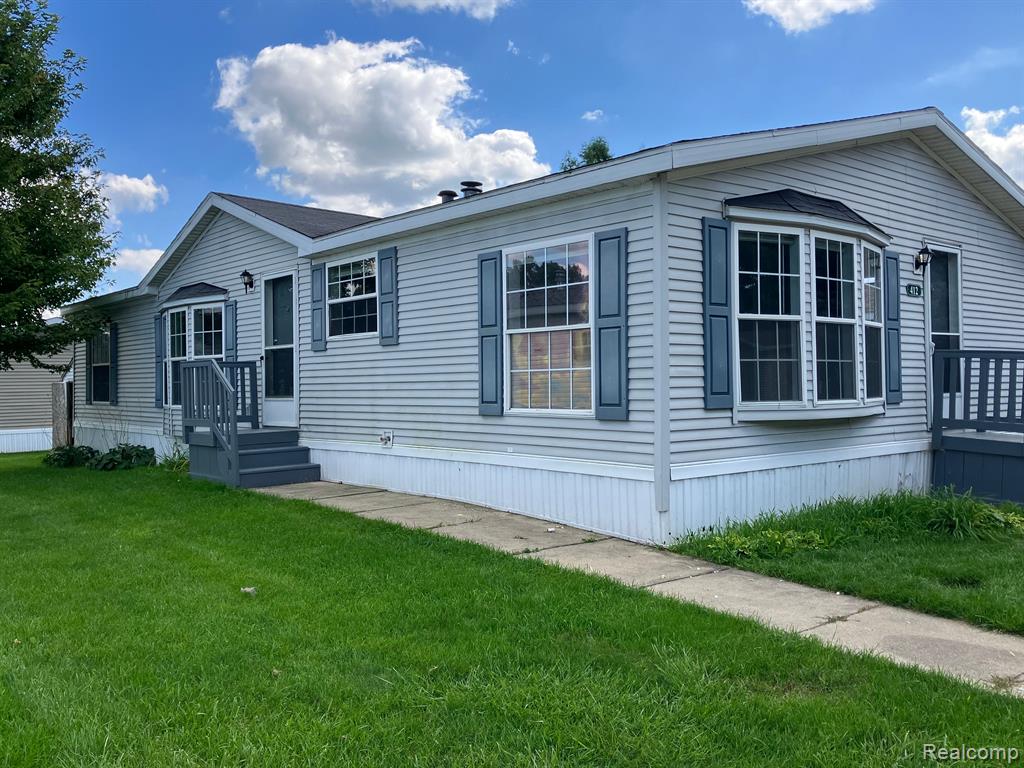 412 N Hidden Ridge Road, Morrice, MI 48857 — front exterior