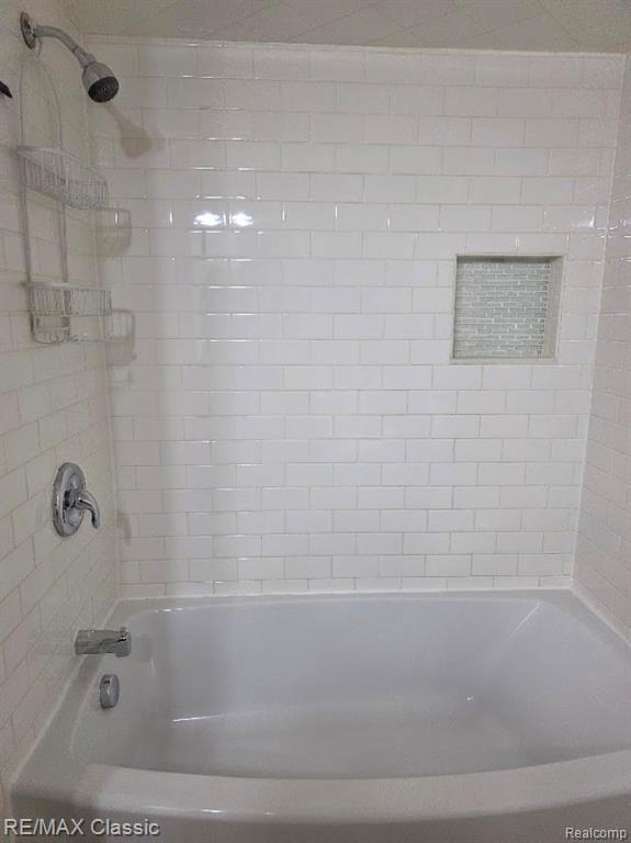 Bathroom featuring shower / bath combination