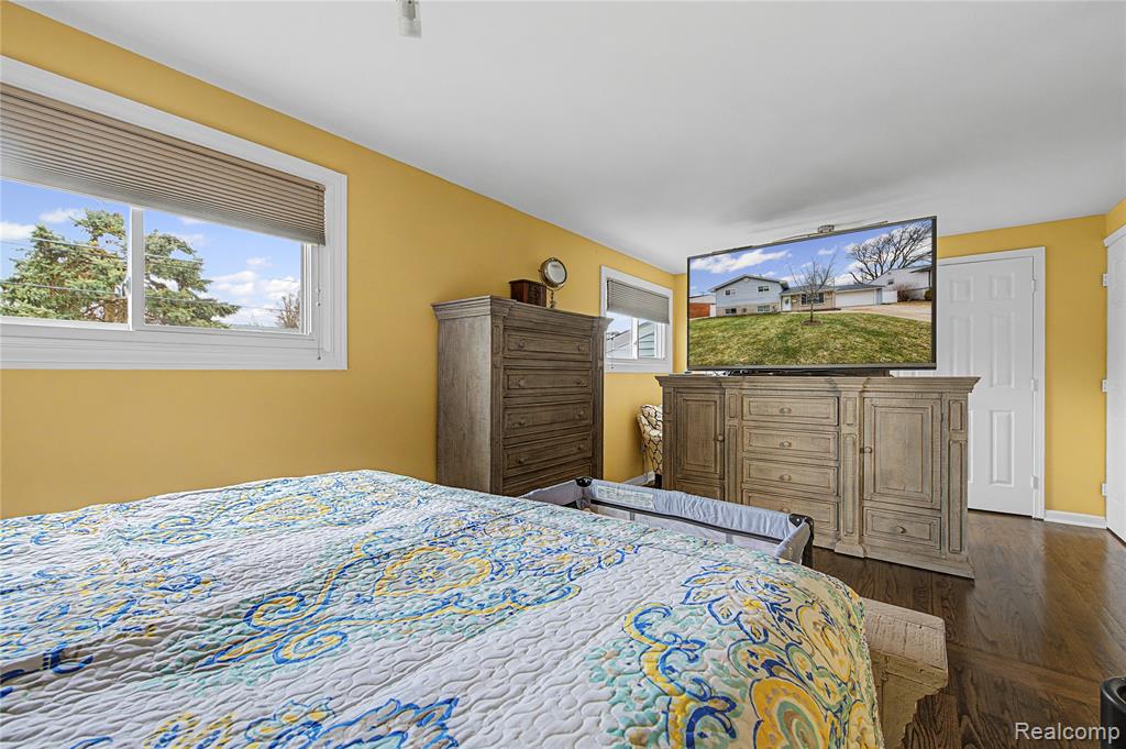 Bedroom featuring dark wood finished floors