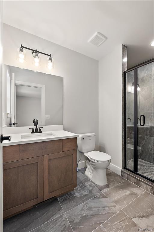 Full bathroom with vanity, and walk in shower