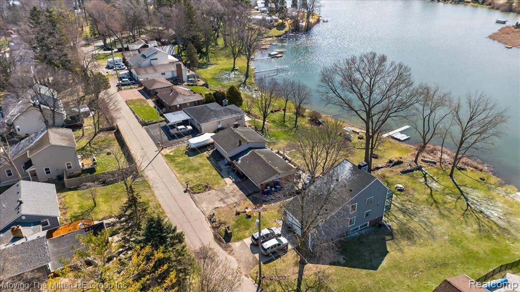 Aerial perspective of suburban area with a nearby body of water