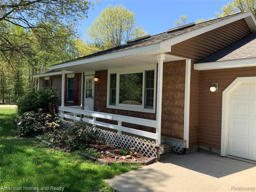 7395 Crestwood Drive, Oscoda, MI 48750 — front exterior