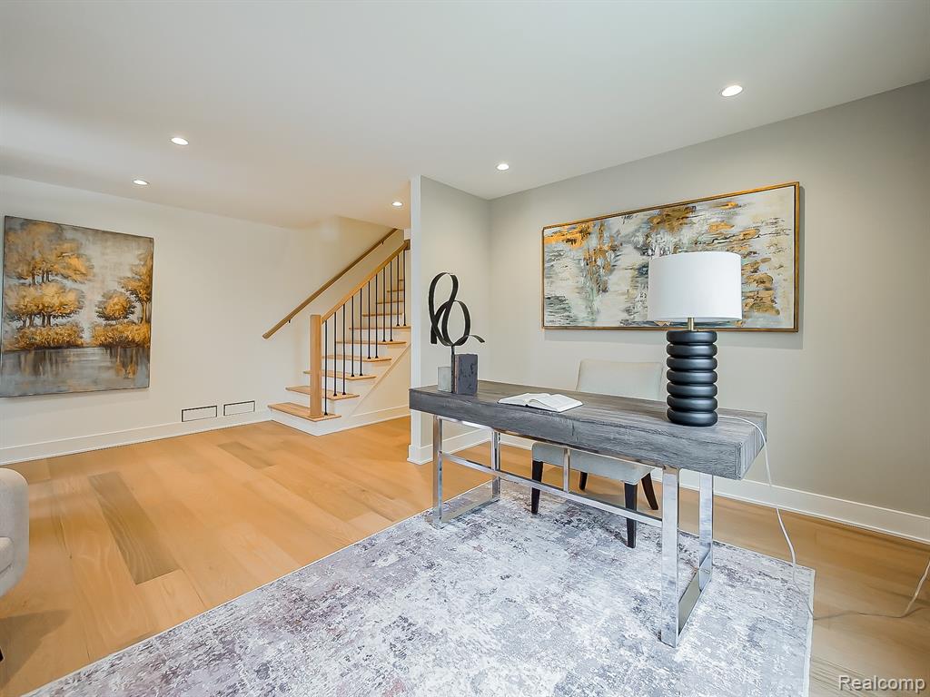 Office with recessed lighting and light wood-type flooring