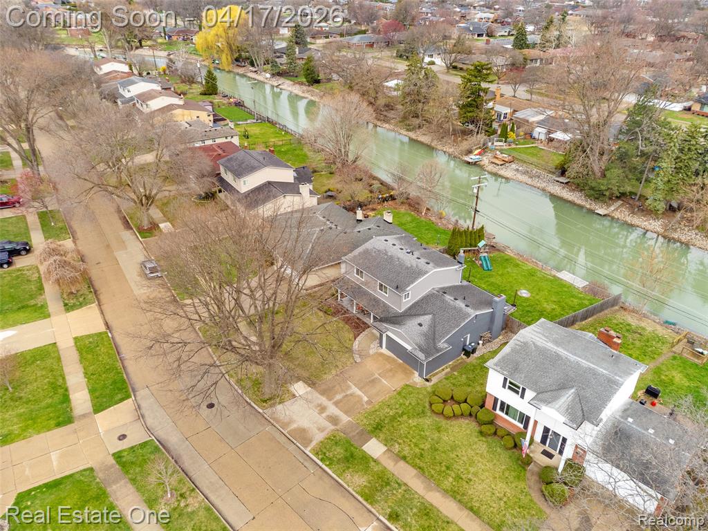 Aerial view of residential area with a large body of water