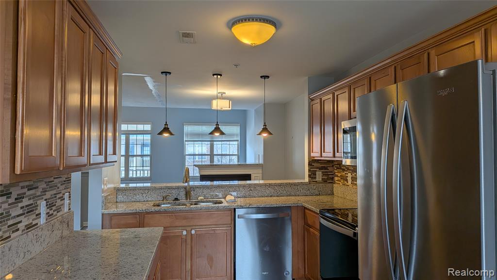 413 VILLAGE Drive, Walled Lake, MI 48390 — Photo 11