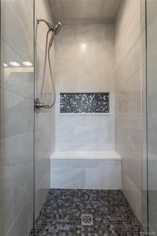 Bathroom featuring tiled shower