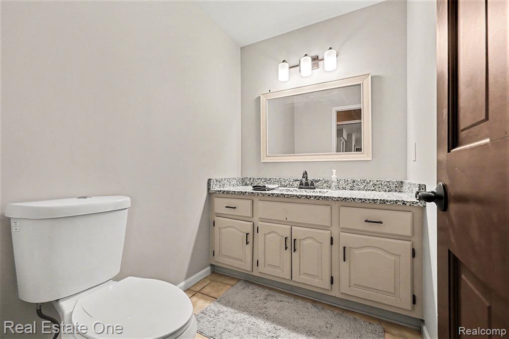 Bathroom with vanity and light tile patterned floors