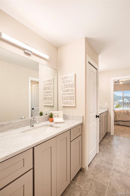 Full bath featuring vanity and ensuite bathroom