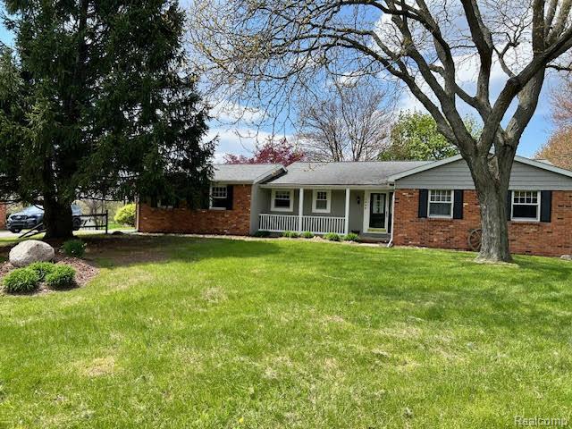 4305 N Hickory Ridge Road, Highland, MI — front exterior