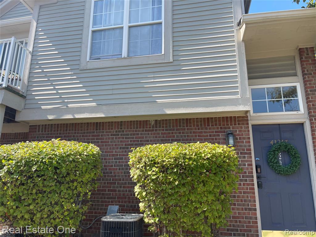 43267 Woodbridge Drive, Clinton Twp, MI 48038 — front exterior