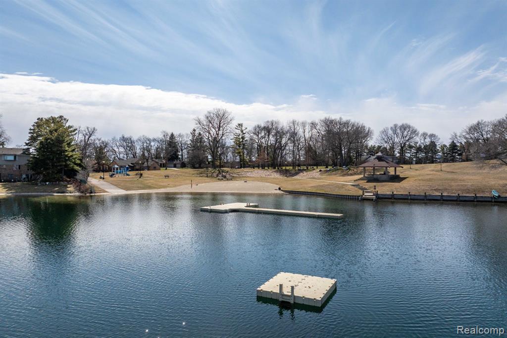 Water view with a floating dock