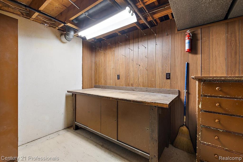 Unfinished basement with wood walls