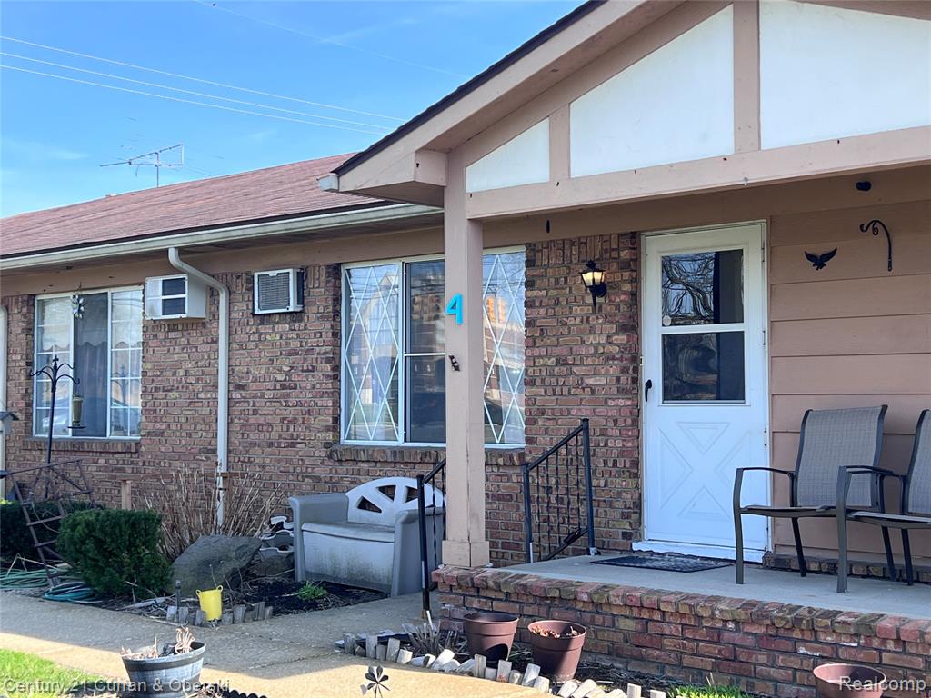 61035 Eleven Mile Road, 4, South Lyon, MI 48178 — front exterior