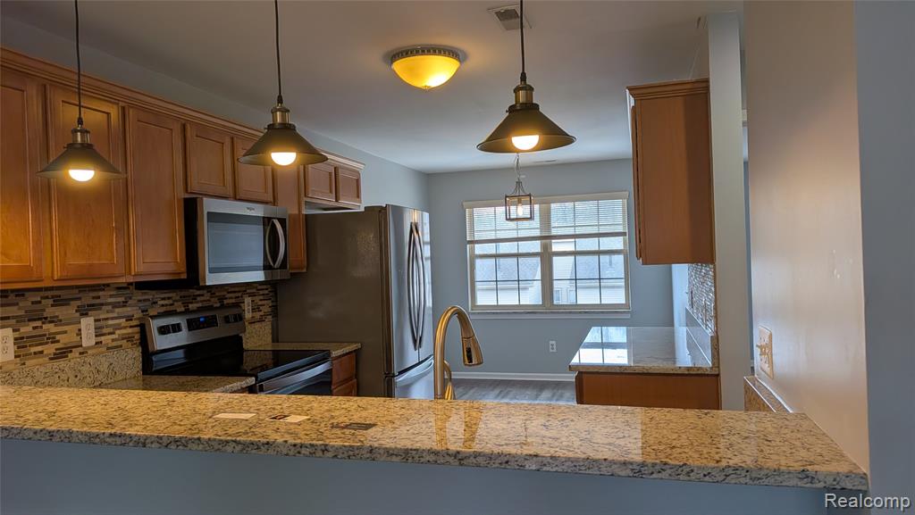 413 VILLAGE Drive, Walled Lake, MI 48390 — Photo 8