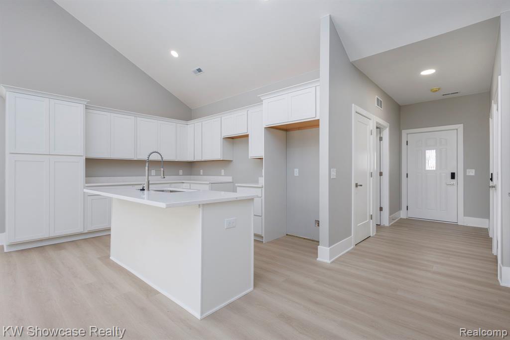 Side View of Structure Under Construction, with 20x10 Rear Covered Porch and backyard.