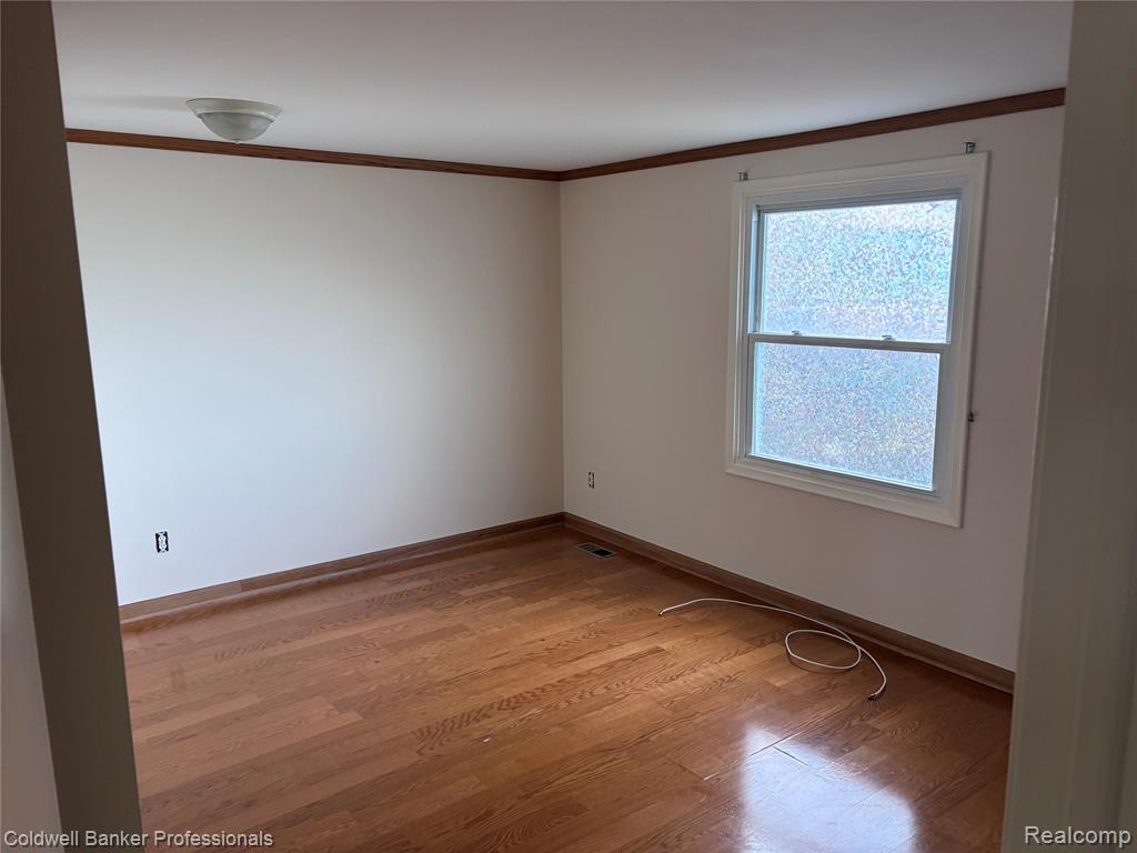 #2 Bedroom featuring crown molding and light wood-style floors
