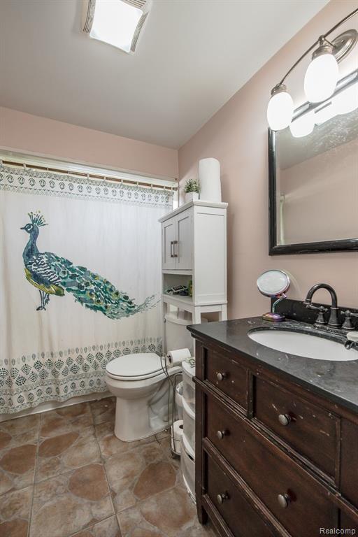 Photo for 36335 Weideman Street, Clinton Twp, MI 48035 - Listing #20251002596 Pretty full bath with granite vanity and tile flooring