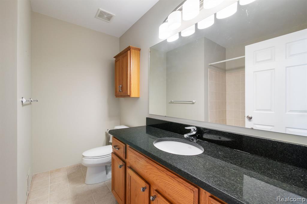 671 Woodhaven Drive, Commerce Twp, MI 48390 — Photo 28