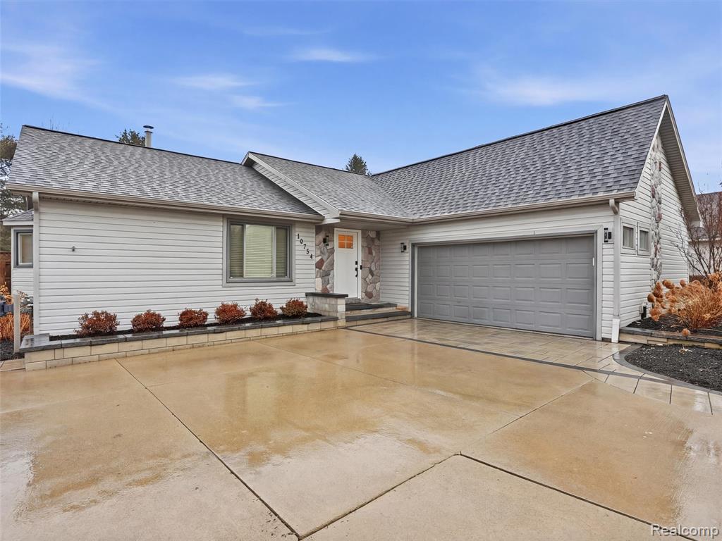 10754 Oxbow Lakeshore Drive, White Lake, MI — front exterior