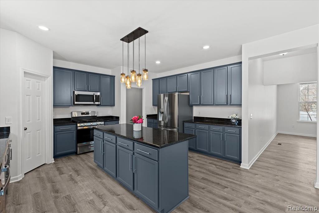 Carpeted empty room with baseboards