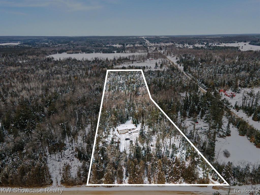 Snowy aerial view with property boundaries highlighted